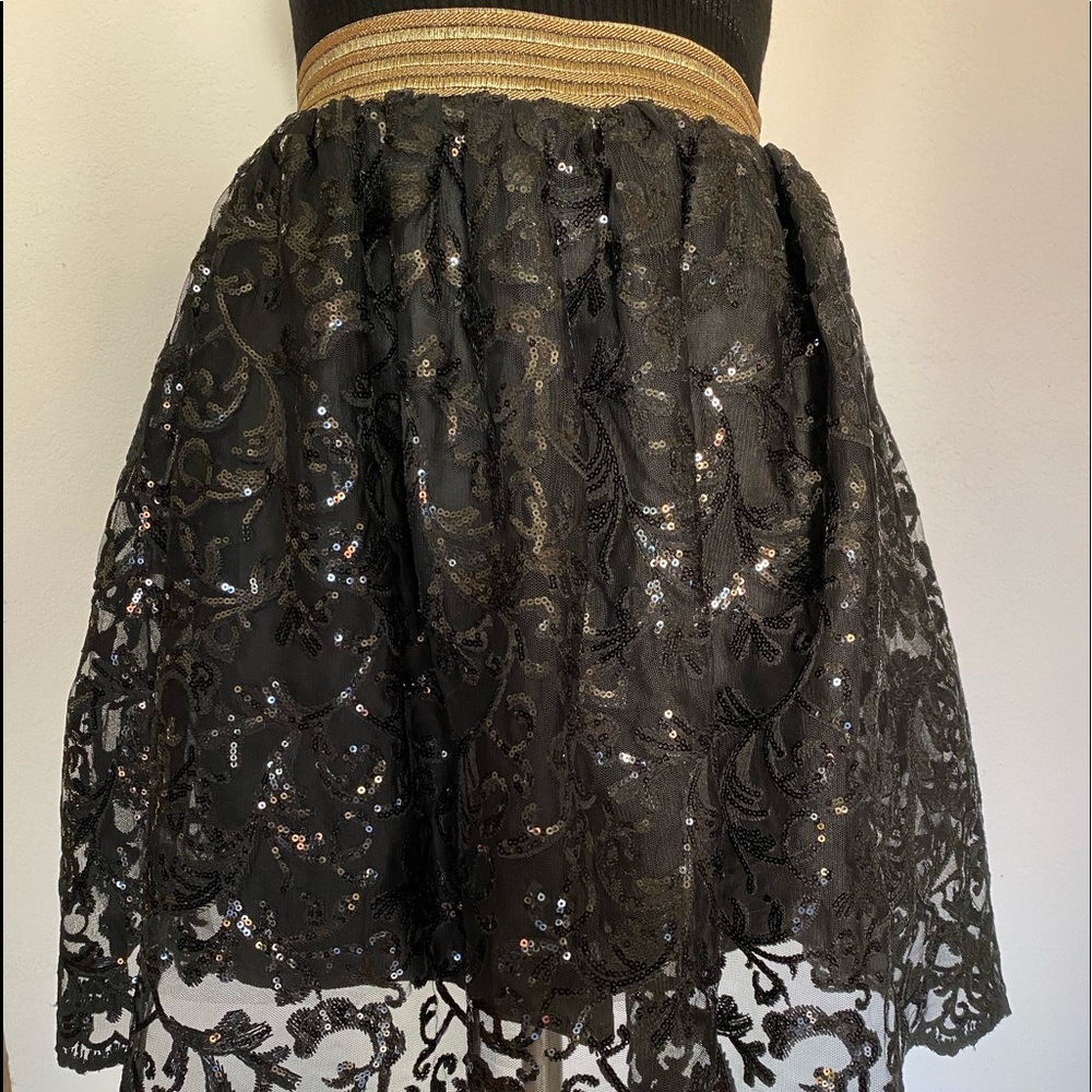 bebe skirt. Size M. Black. Double layer with sequence. Elastic waist band.